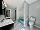 Bathroom with modern tile, dual vanity sinks, a green bathtub and a toilet at 1760 Pumpkinvine Hill Rd, Martinsville, IN 46151