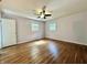 Bedroom with hardwood floors, neutral walls, and natural light from two windows at 1760 Pumpkinvine Hill Rd, Martinsville, IN 46151