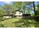 Charming two-story home with a well-maintained lawn and mature trees offering shade at 1760 Pumpkinvine Hill Rd, Martinsville, IN 46151