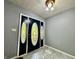 Foyer with decorative front door with detailed glass features at 1760 Pumpkinvine Hill Rd, Martinsville, IN 46151