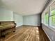 Bright and airy living room with hardwood floors and a large window at 1760 Pumpkinvine Hill Rd, Martinsville, IN 46151