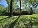 Exterior view of the home showcasing the deck and the surrounding yard at 1760 Pumpkinvine Hill Rd, Martinsville, IN 46151