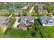 Beautiful aerial view of a home with lush green lawn, patio, deck, and surrounding neighborhood at 1787 Halifax St, Carmel, IN 46032
