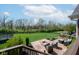 Scenic backyard featuring a fire pit, seating area, and lush green lawn, ideal for outdoor relaxation at 1787 Halifax St, Carmel, IN 46032