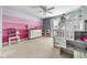 Bright bedroom featuring a bunk bed with stairs and colorful striped walls and plush carpet flooring at 1787 Halifax St, Carmel, IN 46032