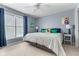 Cozy bedroom featuring a large bed, bright windows, and colorful decor accents at 1787 Halifax St, Carmel, IN 46032