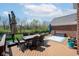 Inviting deck with dining set, perfect for enjoying outdoor meals with a view of the backyard at 1787 Halifax St, Carmel, IN 46032