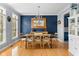 Elegant dining room with hardwood floors, chandelier, and wooden dining table with seating for six at 1787 Halifax St, Carmel, IN 46032