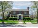 Beautiful two-story brick home featuring a well-maintained lawn and mature trees in a quiet neighborhood at 1787 Halifax St, Carmel, IN 46032