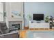 Comfortable living room with fireplace, hardwood floors, and a cozy atmosphere at 1787 Halifax St, Carmel, IN 46032