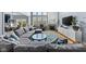 Spacious living room featuring a large sectional sofa, fireplace, and abundant natural light at 1787 Halifax St, Carmel, IN 46032