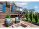 Inviting backyard patio featuring a fire pit, comfortable seating, and a well-manicured lawn at 1787 Halifax St, Carmel, IN 46032