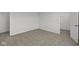 Bedroom with neutral carpet and white walls and walk-in closet at 1874 Victor Higgins Dr, Shelbyville, IN 46176