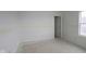 Blank bedroom with a window, open door and natural light, ready to be customized with furniture and decor at 1874 Victor Higgins Dr, Shelbyville, IN 46176