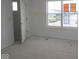 Bare bedroom with ample natural light, with open door to the hall provides a canvas for personal design at 1874 Victor Higgins Dr, Shelbyville, IN 46176