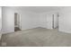 A bright bedroom showcases neutral carpet, white walls, and access to a bathroom and walk-in closet at 1874 Victor Higgins Dr, Shelbyville, IN 46176