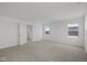 Spacious bedroom with neutral carpet, white walls, and two windows allowing for lots of natural light at 1874 Victor Higgins Dr, Shelbyville, IN 46176