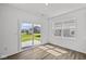 Bright living room with sliding glass door to backyard and lots of natural light from multiple windows at 1874 Victor Higgins Dr, Shelbyville, IN 46176