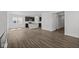 Open floor plan with kitchen island and light-colored wood floors at 1874 Victor Higgins Dr, Shelbyville, IN 46176