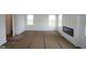 Spacious living room with fireplace, large windows for natural light, and ready for customization and decor at 1874 Victor Higgins Dr, Shelbyville, IN 46176