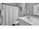 Bathroom featuring a white vanity, and a shower with a white curtain, creating a clean and functional space at 2006 Monticlair Ln, Columbus, IN 47201