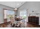 The dining room features a window for natural light and a stylish wooden table at 2006 Monticlair Ln, Columbus, IN 47201