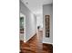 Inviting entryway featuring hardwood floors, gray walls, and a charming 'Welcome' sign at 2006 Monticlair Ln, Columbus, IN 47201