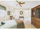 Tranquil bedroom with a ceiling fan, bed, wood furniture, and an exterior door at 2011 Sheffield Ave, Anderson, IN 46011