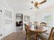 Cozy dining room with a wood table, ceiling fan, and natural light at 2011 Sheffield Ave, Anderson, IN 46011