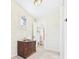 Hallway with decorative walls, an accent window, and access to the bathroom at 2011 Sheffield Ave, Anderson, IN 46011