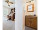 Hallway with decorative walls, a view into the office, and access to a half bathroom at 2011 Sheffield Ave, Anderson, IN 46011
