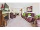 Cozy living room with a fireplace, comfortable seating, and natural light at 2011 Sheffield Ave, Anderson, IN 46011