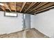 Unfinished basement space with concrete walls and exposed ceiling beams at 2335 Main St, Elwood, IN 46036