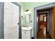 Powder room featuring a white vanity with a mirror and modern lighting at 2335 Main St, Elwood, IN 46036