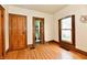 Comfortable bedroom featuring hardwood floors, two doors and a window at 2335 Main St, Elwood, IN 46036