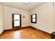 Bright bedroom with hardwood floors and natural light, featuring a horseshoe decoration at 2335 Main St, Elwood, IN 46036