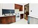 Charming kitchen with wood cabinets, white countertops and white appliances at 2335 Main St, Elwood, IN 46036