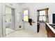 Small laundry room with white cabinets, shelving and natural light from a window at 2335 Main St, Elwood, IN 46036