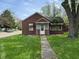 Charming home featuring a well-maintained lawn and a quaint covered entryway at 2501 Mars Hill St, Indianapolis, IN 46241