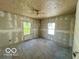 Spacious bedroom with two windows and a ceiling fan, ready for customization at 2701 N Gale St, Indianapolis, IN 46218