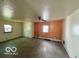 Open-concept living room with tile flooring and ample natural light at 2701 N Gale St, Indianapolis, IN 46218