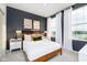 Comfortable bedroom with large windows, neutral walls, and dark accents at 3279 Morab Dr, Zionsville, IN 46077