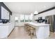 Contemporary kitchen with an island, stainless steel appliances, and ample countertop space, ideal for cooking at 3279 Morab Dr, Zionsville, IN 46077