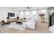 Stylish living room with modern decor, large windows, and an open floor plan at 3279 Morab Dr, Zionsville, IN 46077
