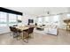 Spacious living room and dining area featuring large windows, modern decor, and abundant natural light at 3279 Morab Dr, Zionsville, IN 46077