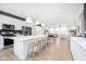 Spacious living area showcasing a modern kitchen, dining space, and inviting living room, perfect for gatherings at 3279 Morab Dr, Zionsville, IN 46077