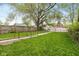 Spacious backyard with green grass and a rustic fence, perfect for outdoor activities and privacy at 33 N Beville Ave, Indianapolis, IN 46201