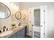 Stylish bathroom with double sinks, granite countertops, and decorative accents at 33 N Beville Ave, Indianapolis, IN 46201
