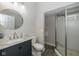 Bathroom with modern vanity, marble countertop, and glass-enclosed shower at 33 N Beville Ave, Indianapolis, IN 46201