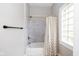 Well-lit bathroom with shower-tub combo and classic design elements at 33 N Beville Ave, Indianapolis, IN 46201